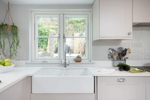 Beach Cottage, St Agnes. Ground floor: Fully-fitted kitchen with double electric oven, hob, microwave, American fridge freezer, dishwasher, wine fridge, coffee machine and Bluetooth speaker