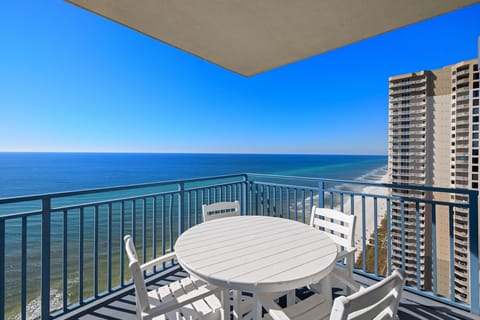 This expansive corner balcony features a dining table and four chairs for eating your meals and enjoying the sunset. You can even see all the way to Destin on a clear day!