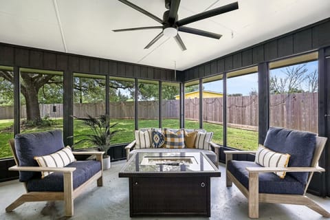 Screened Porch perfect for gathering with comfy outdoor furniture