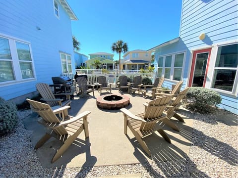 Cozy fire pit area with Adirondack chairs for evening gatherings.