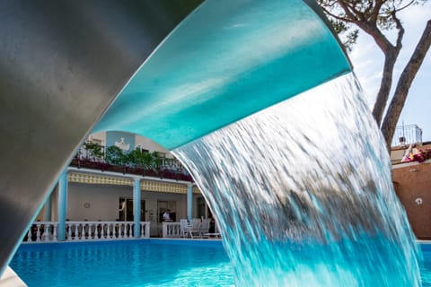 Seasonal outdoor pool, open 10:00 AM to 7:30 PM, pool umbrellas