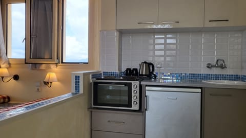 Apartment | Private kitchen | Fridge, stovetop, electric kettle, cookware/dishes/utensils