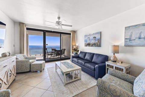 Living room w/ access to the large patio and views of the ocean.