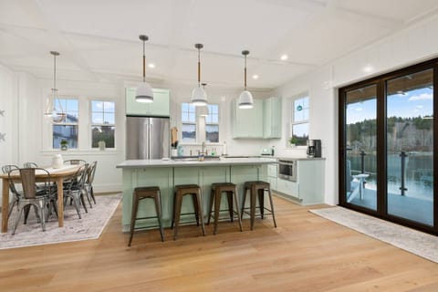 The open space kitchen and dining room allow for excellent views while preparing and enjoying dinner.