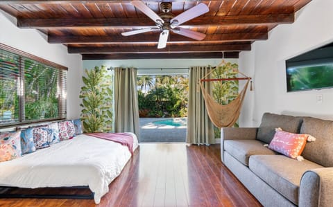 Living area with a bedroom and a view