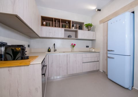Villa | Private kitchen | Full-size fridge, oven, stovetop, dishwasher