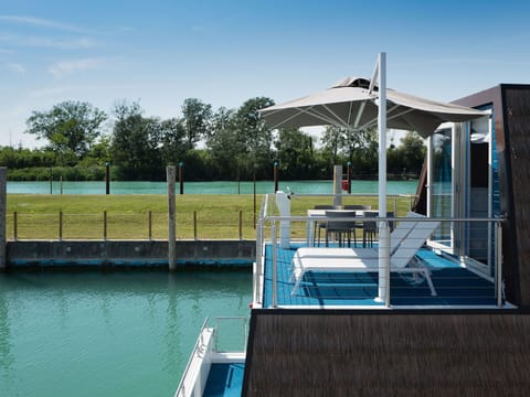 Water, Sky, Plant, Shade, Swimming Pool, Outdoor Furniture, Tree, Rectangle, Sunlounger, Leisure