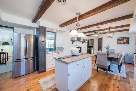 Enjoy a meal with loved ones in this spacious and bright kitchen/dining room!