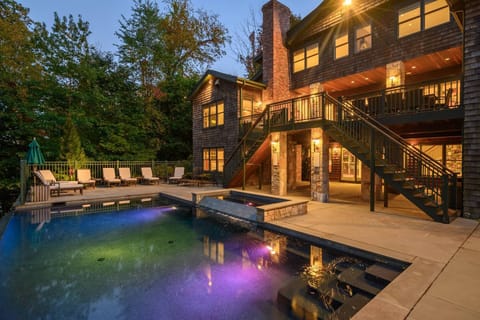 Ready for your summer escape.  Infinity pool and hot tub in fenced in yard overlooking the lake.