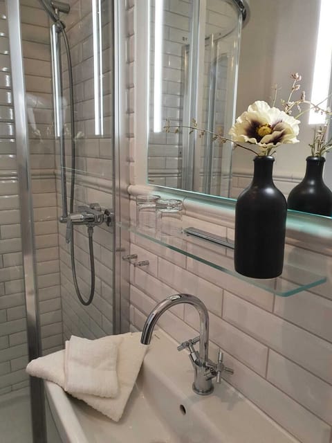 Eco-friendly toiletries, hair dryer, slippers, towels