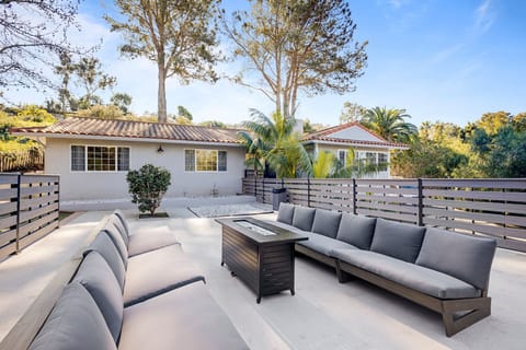 Front garage deck overlooking front yard playground and with an ocean view 