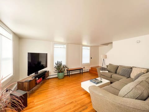 Living Room With 65" Smart TV & Sound System: 1st Floor