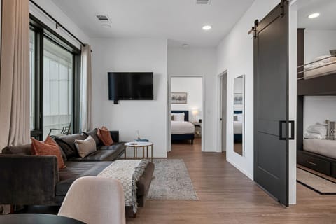 The kitchen opens up into the living room. Watch your favorite show on our smart TV. The sofa turns into a pullout couch. Queen air mattress also available!
