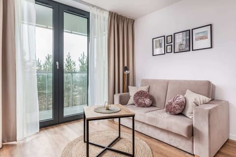Living room with a comfortable sofa and TV. 