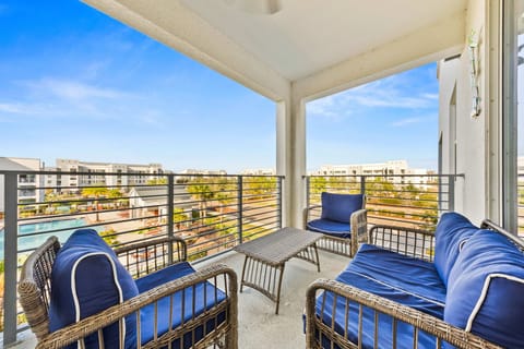 Lush private balcony of the condo in Kissimmee Florida - Enjoy outdoor seating and spectacular views from the balcony - Perfect for relaxing evenings and morning coffee conversations - Enhance your living experience with a personal balcony