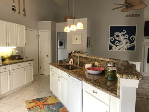 Large open kitchen with bar seats 