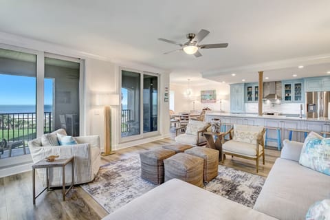 Magnificent Family Room with Stunning Oceanfront Views, a Flat Screen Smart TV, and an Electric Fireplace