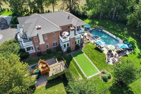 Overhead view of the Long Lane Estate with Swimming Pool, Hot Tub, Golf Putting Green, Fire pit, Pirate Ship Playground, Lounging Chairs & More!
