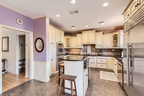 Bright, spacious kitchen with modern appliances and an island for added convenience.