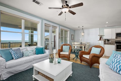 Spacious open floor plan with ocean views from living, dining, & kitchen.