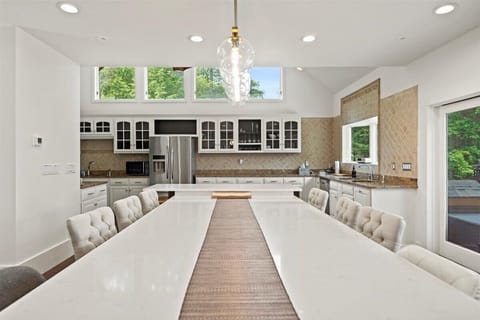 Big kitchen opening up to the patio with a full length patio door.