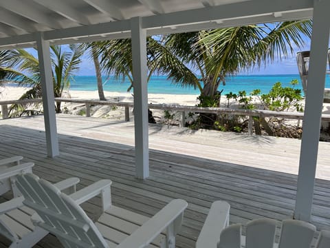 Sea Biscuit's porch and deck overlooks the turquoise sea.