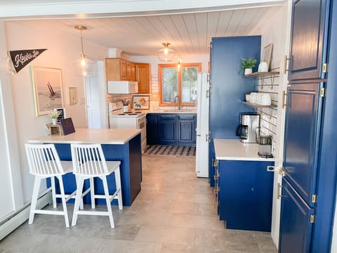 Updated kitchen with oven, microwave, dishwasher and coffee bar