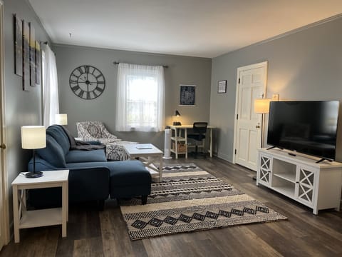 Living Room w/sectional sleeper, desk, two closets, chair and Roku TV