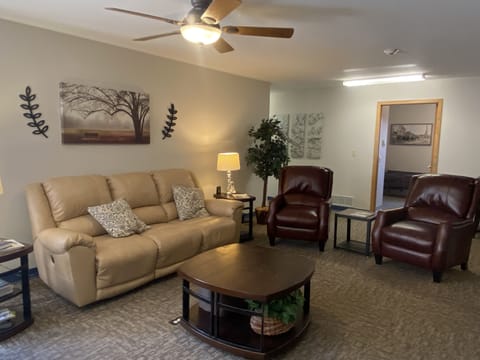 Living Room, power reclining couch and loveseat, television
