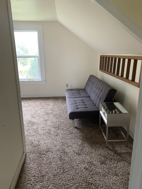 Upstairs sitting room with fold out couch.