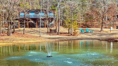 Exterior View: Enjoy serene lake views and lounge in vibrant seating by the Whispering Pond!