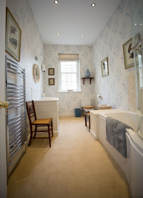 Private bathroom with overhead shower