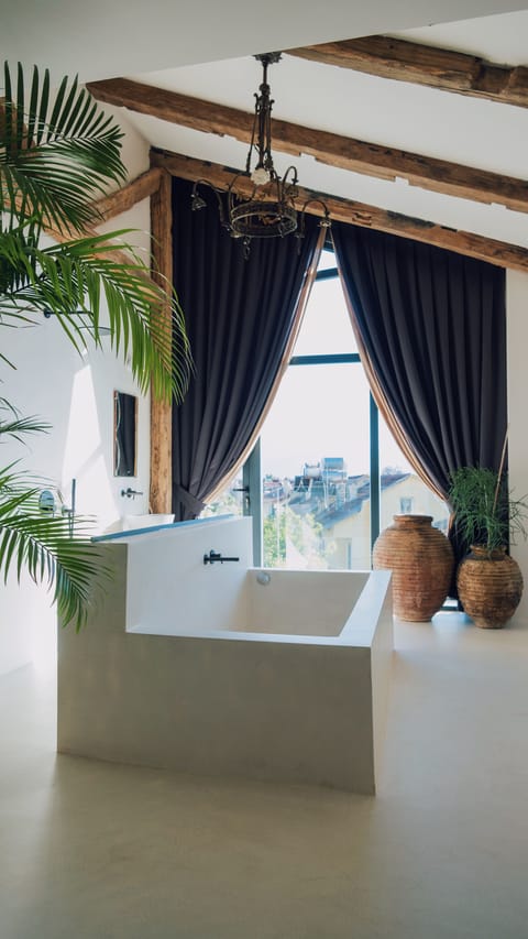 Suite with Bathtub and Terrace | Bathroom | Hair dryer, slippers, towels, soap