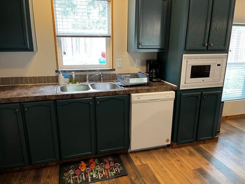 Kitchen has dishwasher and microwave
