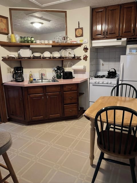 Third floor kitchen & dining table (counter seating to the left as well.)