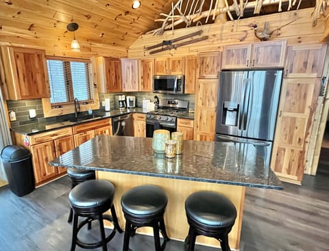 Kitchen has newer appliances & plenty of cabinet & pantry space. Island sits 4