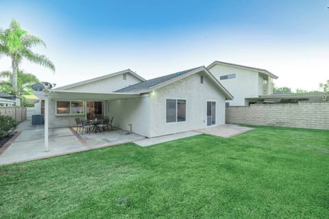 Enjoy this gorgeous fenced in backyard with lawn 