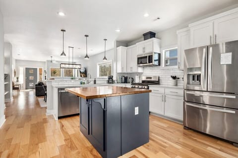 In the center of our kitchen, you'll see our STUNNING wood-top island, which provides the perfect place to prep or serve your best dishes.