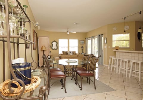 Relax in this spacious open-concept retreat where natural light pours through large windows, inviting you to unwind at the dining table or sink into plush seating with loved ones.