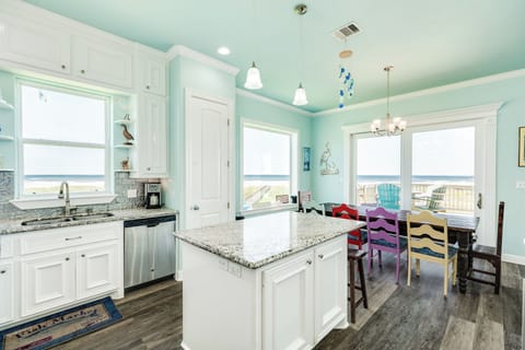 Easily serve meals from the adjacent kitchen island