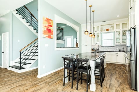 Additional seating at the adjacent kitchen island