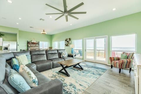Living room with wall of windows showcasing the beachfront views