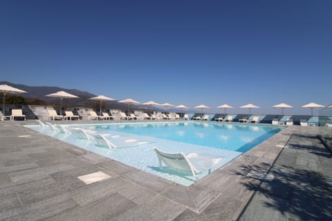 Outdoor pool, open 10:00 AM to 9:00 PM, pool umbrellas, sun loungers