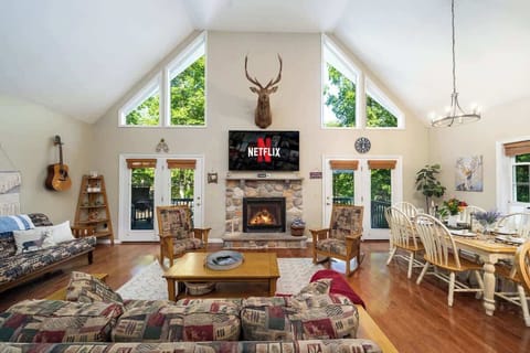 Snuggle up in this dreamy living room where the fireplace keeps you warm and the TV keeps you entertained! 