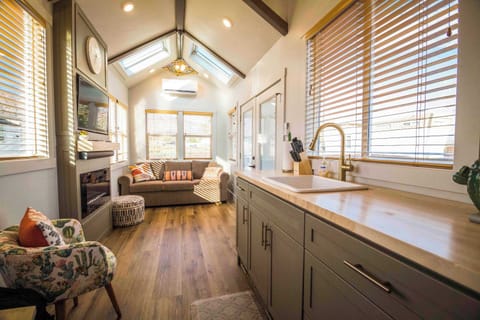 Bright Suncatcher tiny home interior with a well-equipped kitchen, natural light, and an open layout for a relaxing Southern Utah stay near Zion National Park.
