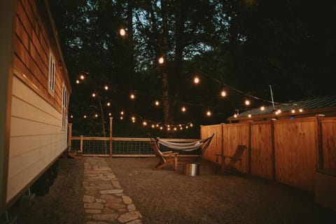 Cozy private smokeless fire pit for roasting marshmallows or having a casual conversation. The lights come on automatically at dusk, lighting the way for your late arrival if needed. Private whole house cozy cottage on relaxing burbling creek. Gateway to
