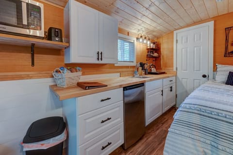 2 burner hot plate, kettle, and more in the kitchen.