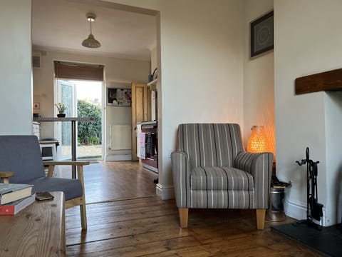 From the little sitting room to the kitchen and garden beyond 
