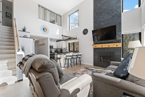 Relax in this stunning open-concept space where vaulted ceilings and natural light create an airy retreat for your getaway.