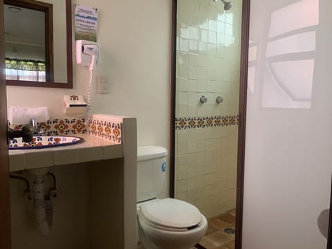 Shower, rainfall showerhead, hair dryer, towels